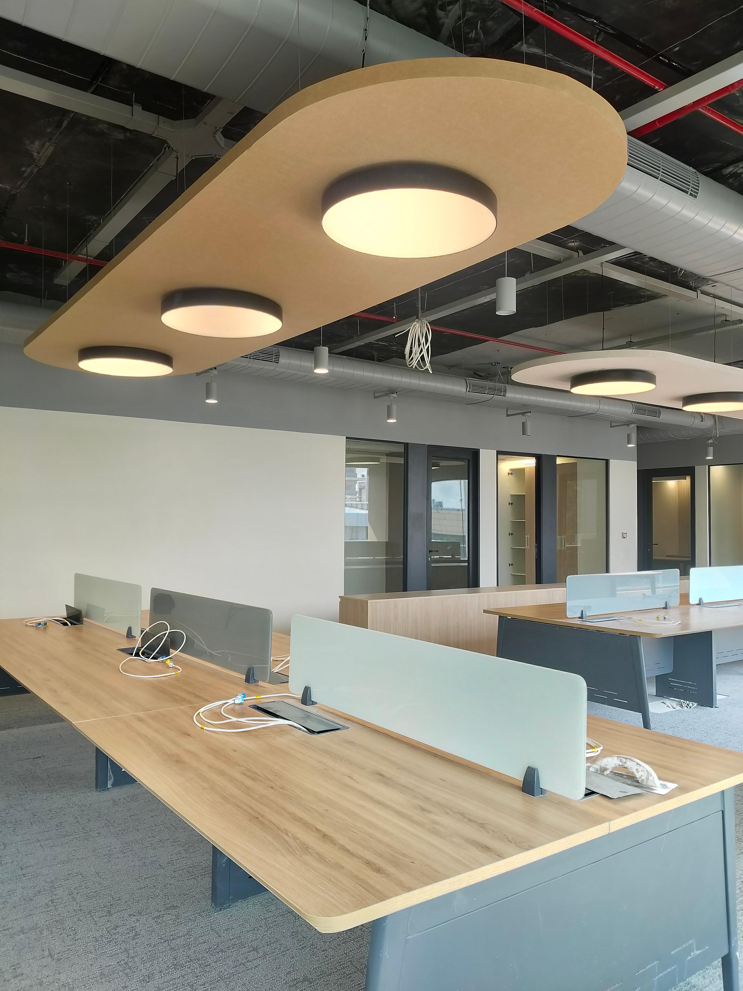 Acoustic walls project detail — warm terracotta gallery space with cove lighting and polished wood flooring