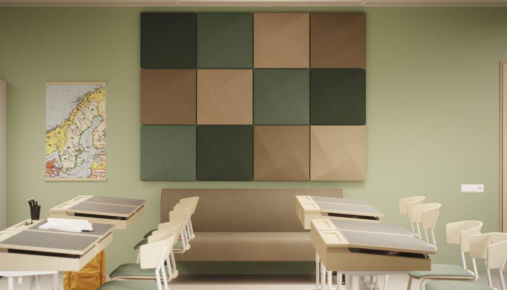 Modern classroom interior with geometric acoustic wall panels and study seating